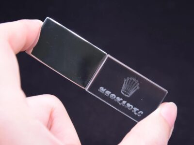 Person Holding Transparent Block USB With Logo