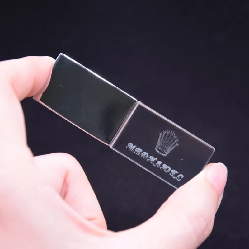 Person Holding Transparent Block USB With Logo