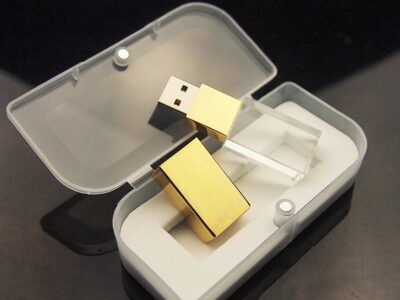Gold Block USB Resting On Case