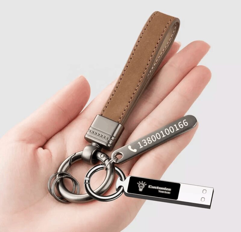 person holding stylish luminous USB drive
